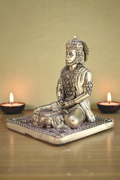 Rigvedaa brass idol of Lord Hanuman meditating in Ram Sadhna posture, adorned with intricate jewelry, seated on a decorative base.