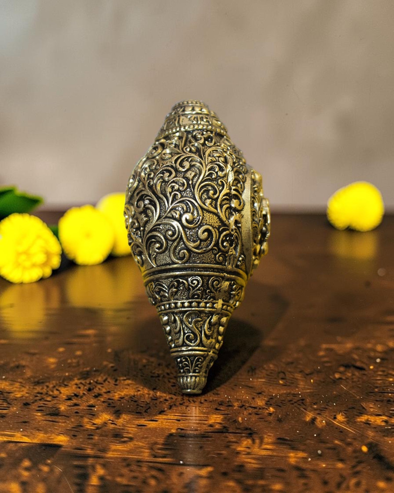 Rigvedaa™ brass Hanuman shankh with intricate scrollwork engraving, ideal for pooja and home mandir.