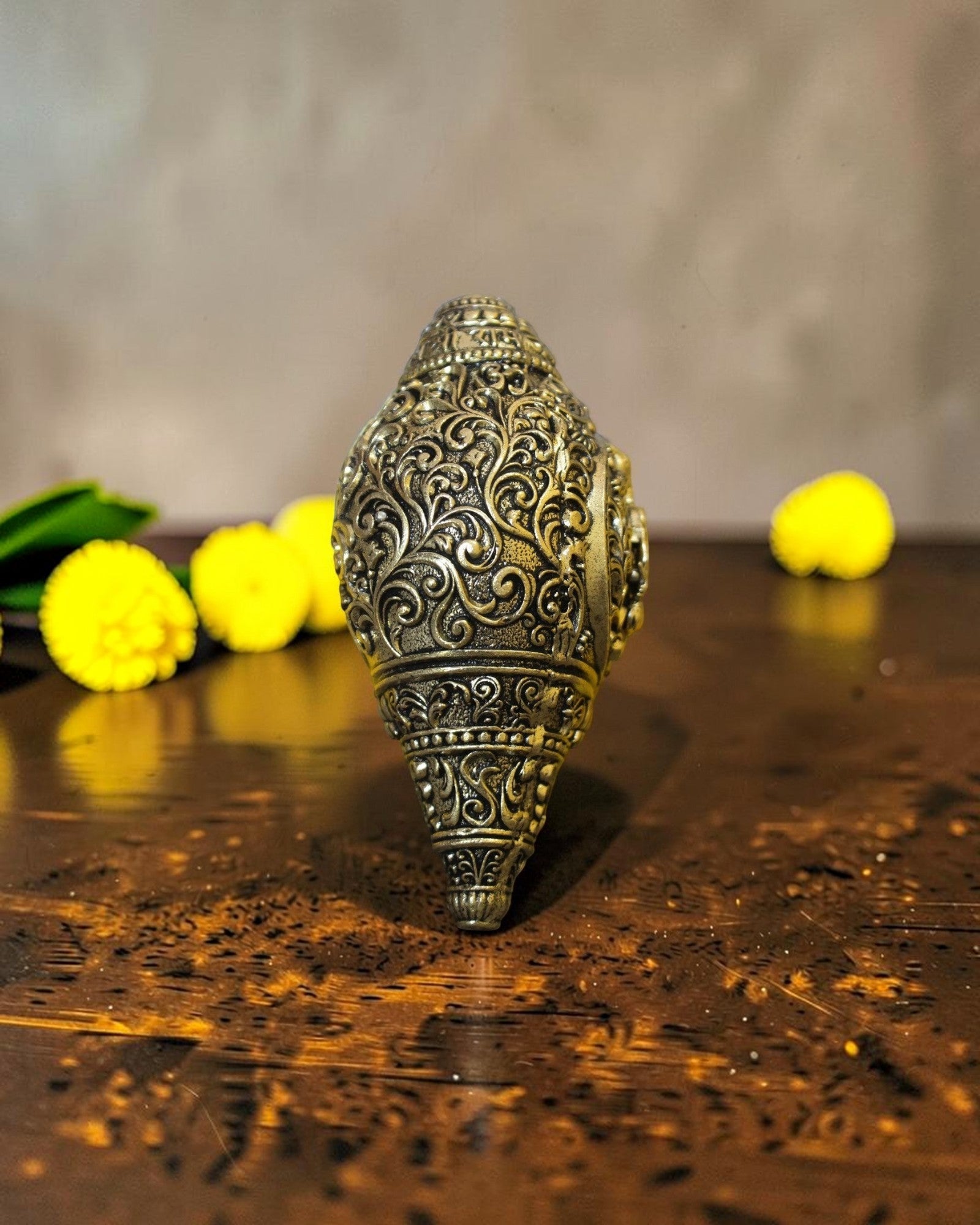 Rigvedaa™ brass Hanuman shankh with intricate scrollwork engraving, ideal for pooja and home mandir.