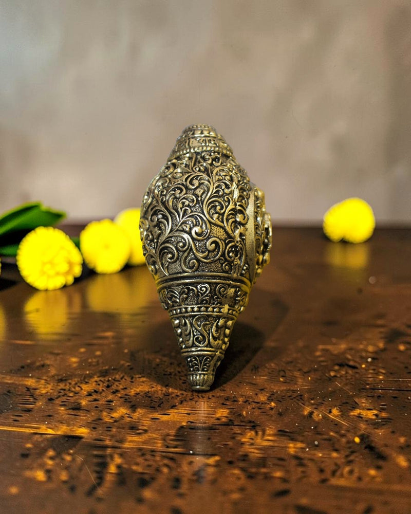 Rigvedaa™ brass Hanuman shankh with intricate scrollwork engraving, ideal for pooja and home mandir.