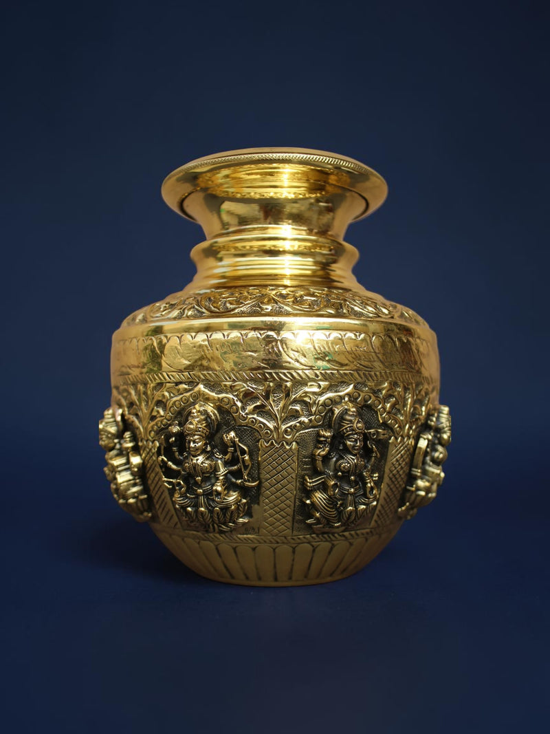 Rigvedaa™ handcrafted brass kalash pot with polished gold finish and intricate embossed deity carvings