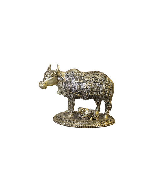 Rigvedaa™ brass Kamdhenu cow and calf idol with intricate engravings of Hindu gods, symbolizing prosperity and divine blessings.