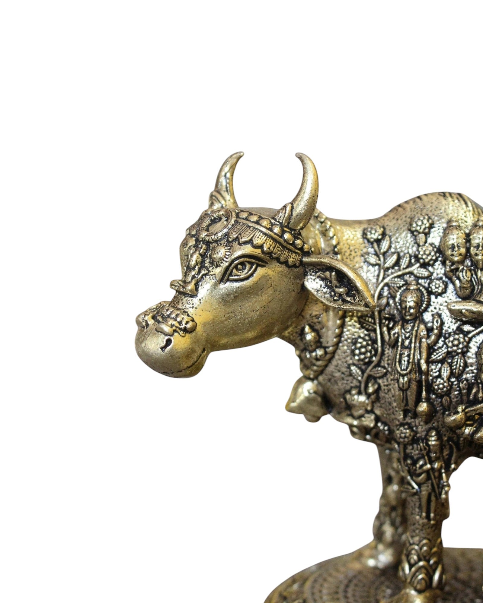 Rigvedaa brass Kamdhenu cow and calf idol with engraved gods, symbolizing prosperity and divine blessings.