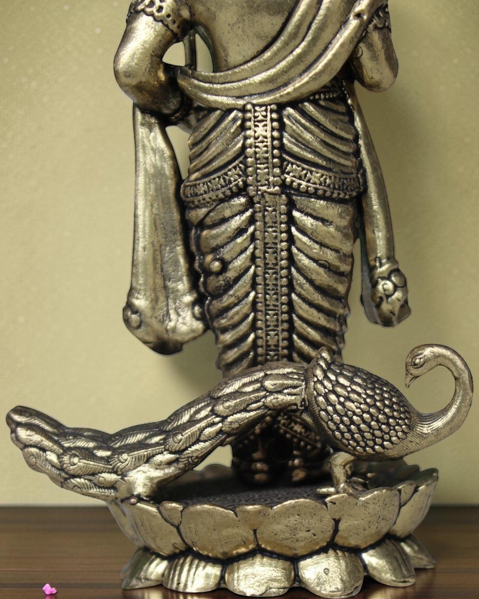 Rigvedaa brass Lord Kartikeya idol with peacock, holding spear, for pooja room and home decor.