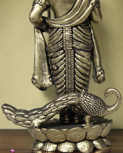 Rigvedaa brass Lord Kartikeya idol with peacock, holding spear, for pooja room and home decor.