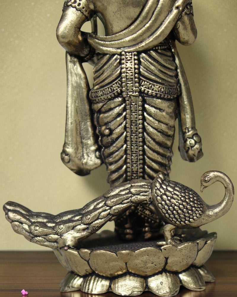 Rigvedaa brass Lord Kartikeya idol with peacock, holding spear, for pooja room and home decor.