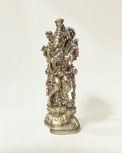 Rigvedaa™ brass Krishna idol with flute, 7.5 inch, standing in Tribhanga pose with peacock crown and intricate details.