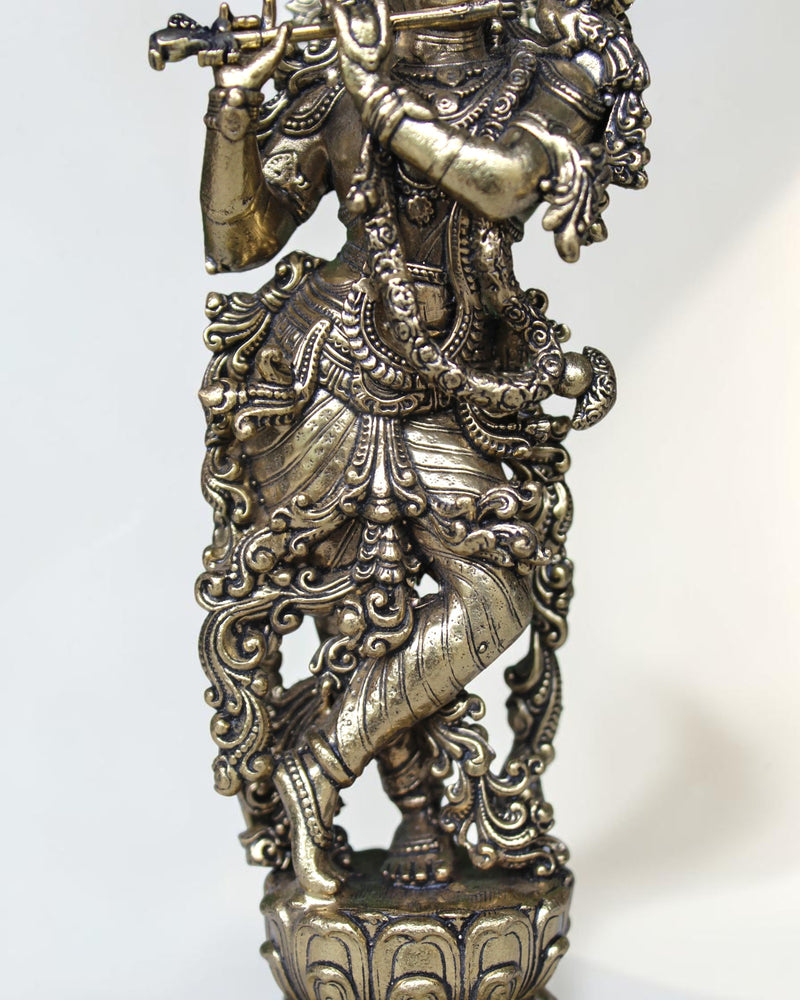 Rigvedaa™ brass Krishna idol with flute, 7.5 inch, detailed Tribhanga pose, peacock crown, golden finish.