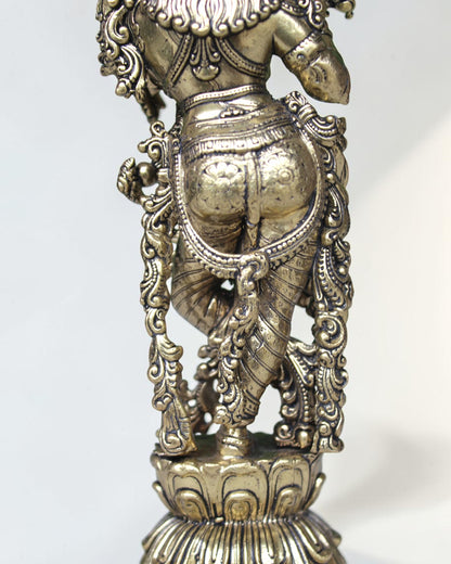 Rigvedaa brass Krishna idol with flute, 7.5 inch, in Tribhanga pose with peacock crown, golden finish.