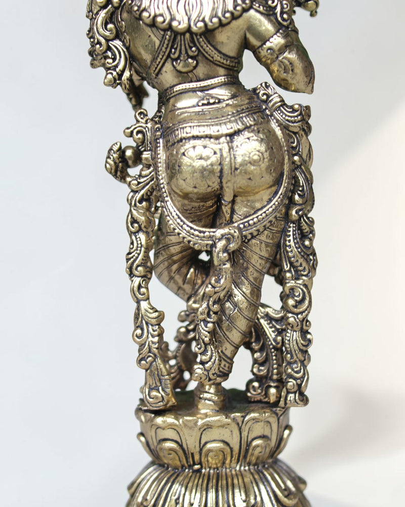 Rigvedaa brass Krishna idol with flute, 7.5 inch, in Tribhanga pose with peacock crown, golden finish.