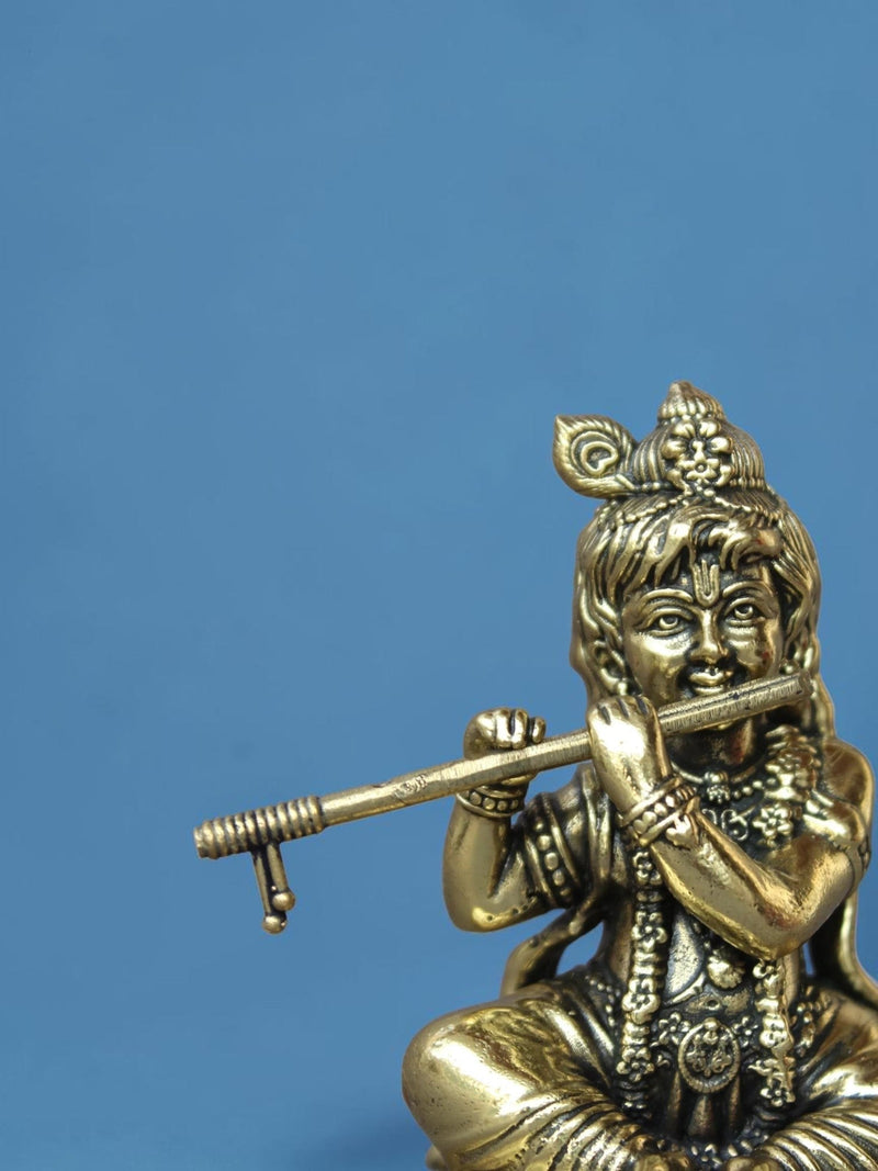 Rigvedaa™ brass Laddu Gopal idol featuring Lord Krishna with a flute and ornate peacock crown in antique gold finish