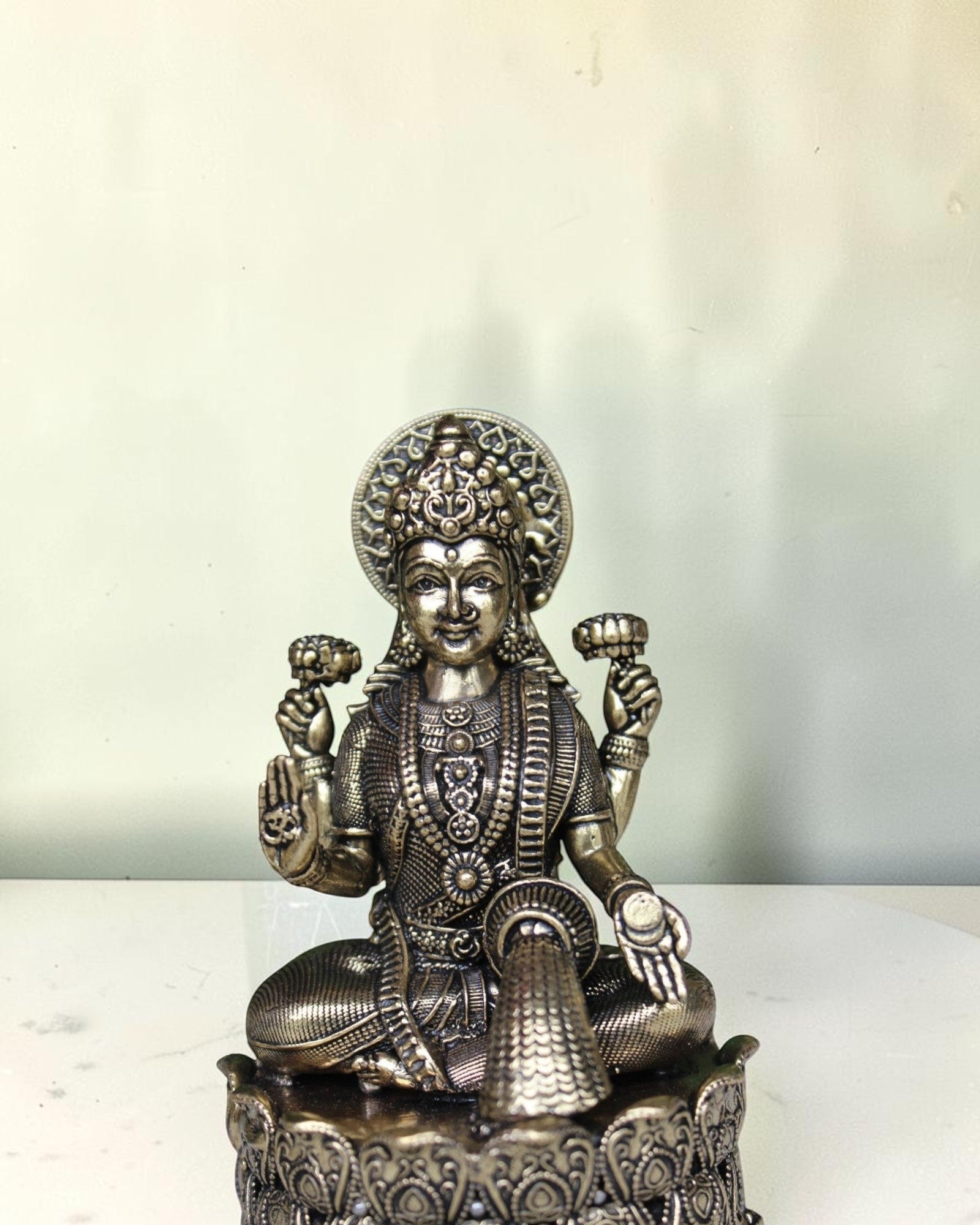 Rigvedaa brass Lakshmi Ganesh idol seated on lotus, intricate detailing, golden finish, 4 inch height.