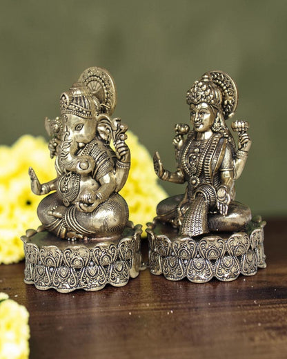 Rigvedaa brass Lakshmi Ganesh idol on lotus base, intricate detailing, golden finish, for wealth and wisdom.
