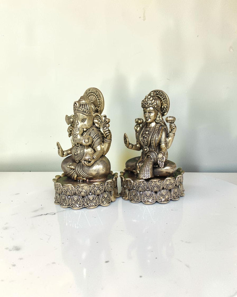 Rigvedaa brass Lakshmi Ganesh idol on lotus base, intricate detailing, golden finish, for wealth and wisdom.