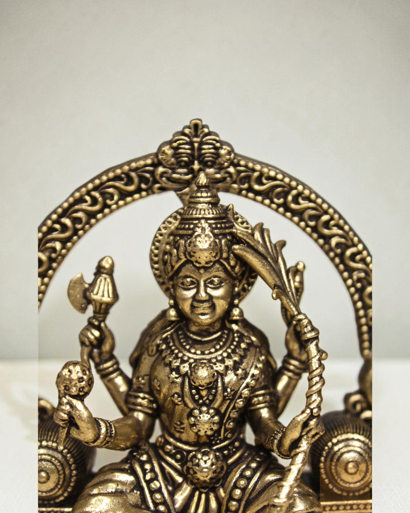 Rigvedaa™ Brass Lalitha Tripura Sundari Devi idol, 4-inch, golden patina, intricate traditional relief work, holding axe and bow.