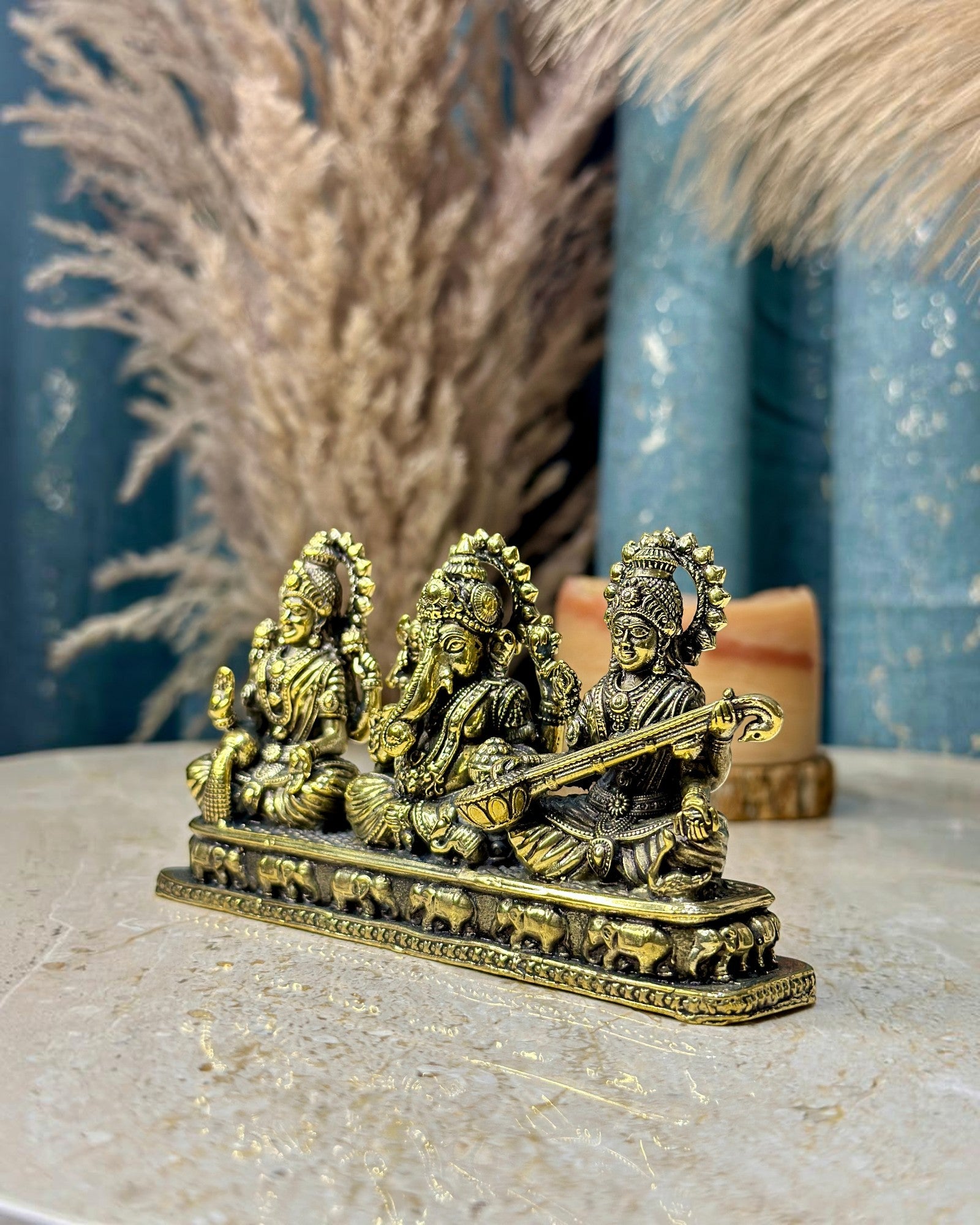 Rigvedaa Brass Laxmi Ganesh Saraswati Idol Set, golden patina, intricate details, for home or office altar.