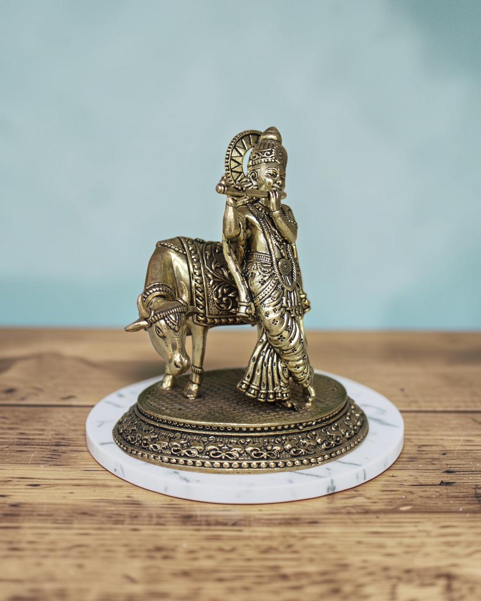 Rigvedaa™ Brass Lord Krishna playing flute with cow statue, 5 inch, intricate details, golden patina.