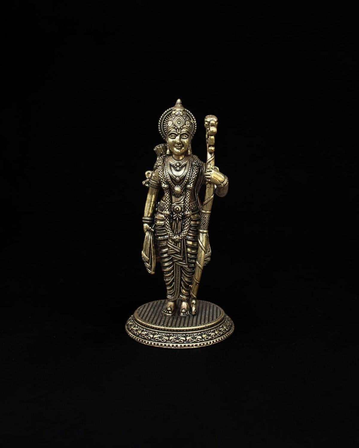 Rigvedaa™ handcrafted brass statue of Lord Rama featuring intricate royal crown and traditional bow on a circular base
