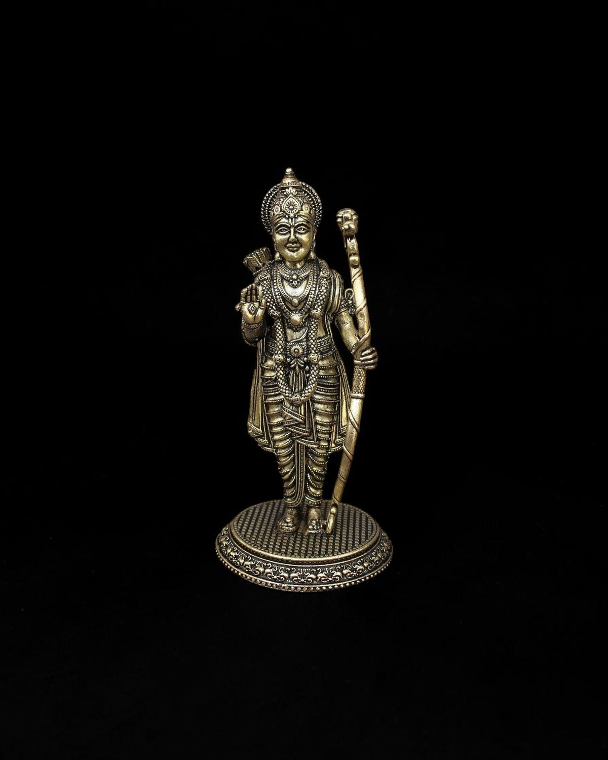Rigvedaa™ handcrafted brass Lord Rama statue with intricate crown and bow details on a textured circular pedestal