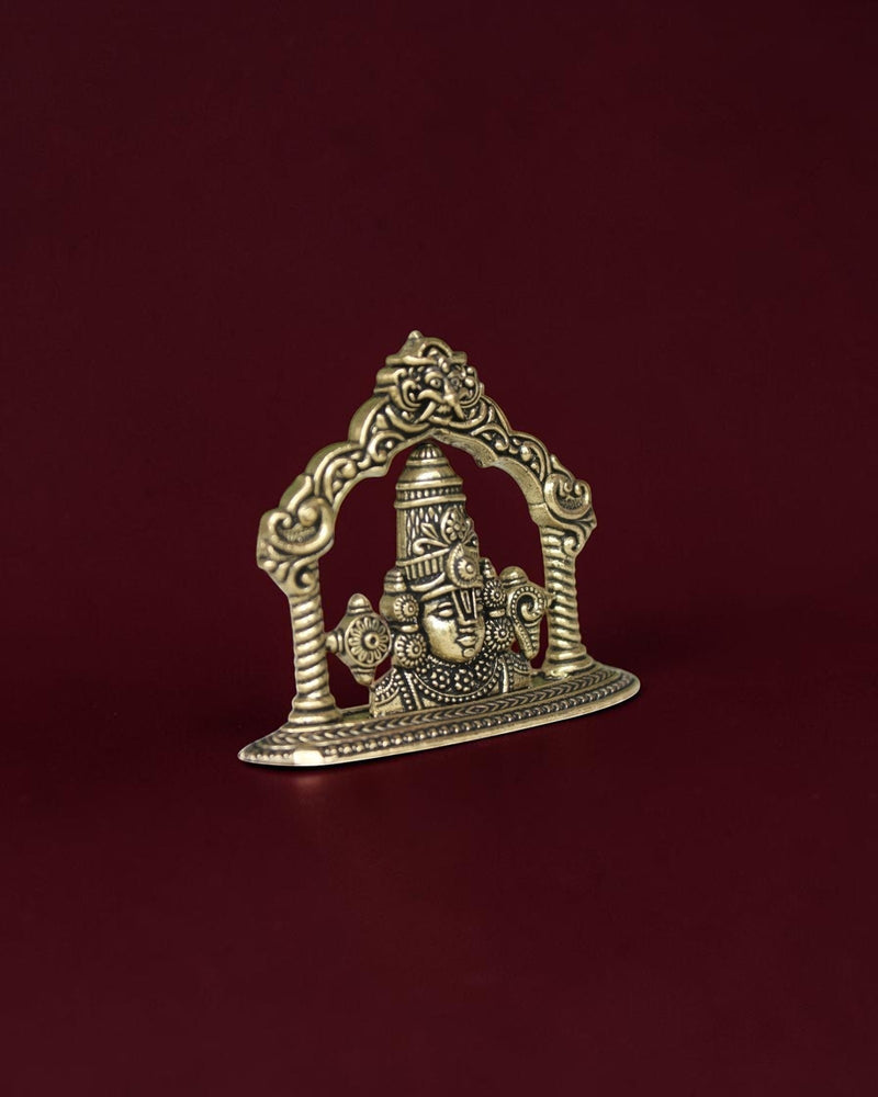 Rigvedaa™ brass Lord Venkateswara Tirupati Balaji face idol with intricate crown and 2D relief design on dark background