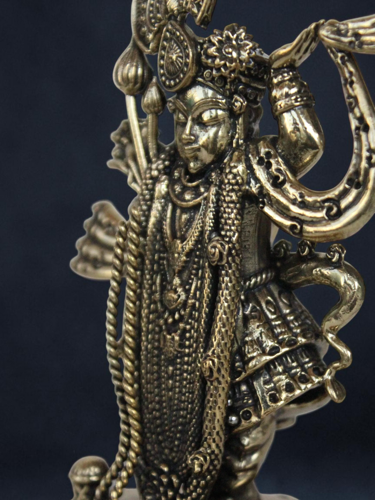 Rigvedaa™ decorative brass Lord Vishnu idol with intricate antique gold finish and detailed traditional ornamentation.