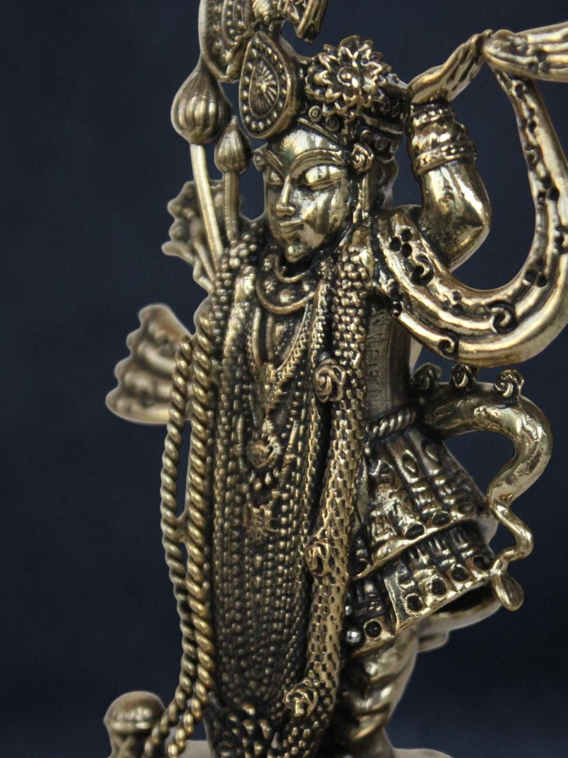 Rigvedaa™ decorative brass Lord Vishnu idol with intricate antique gold finish and detailed traditional ornamentation.