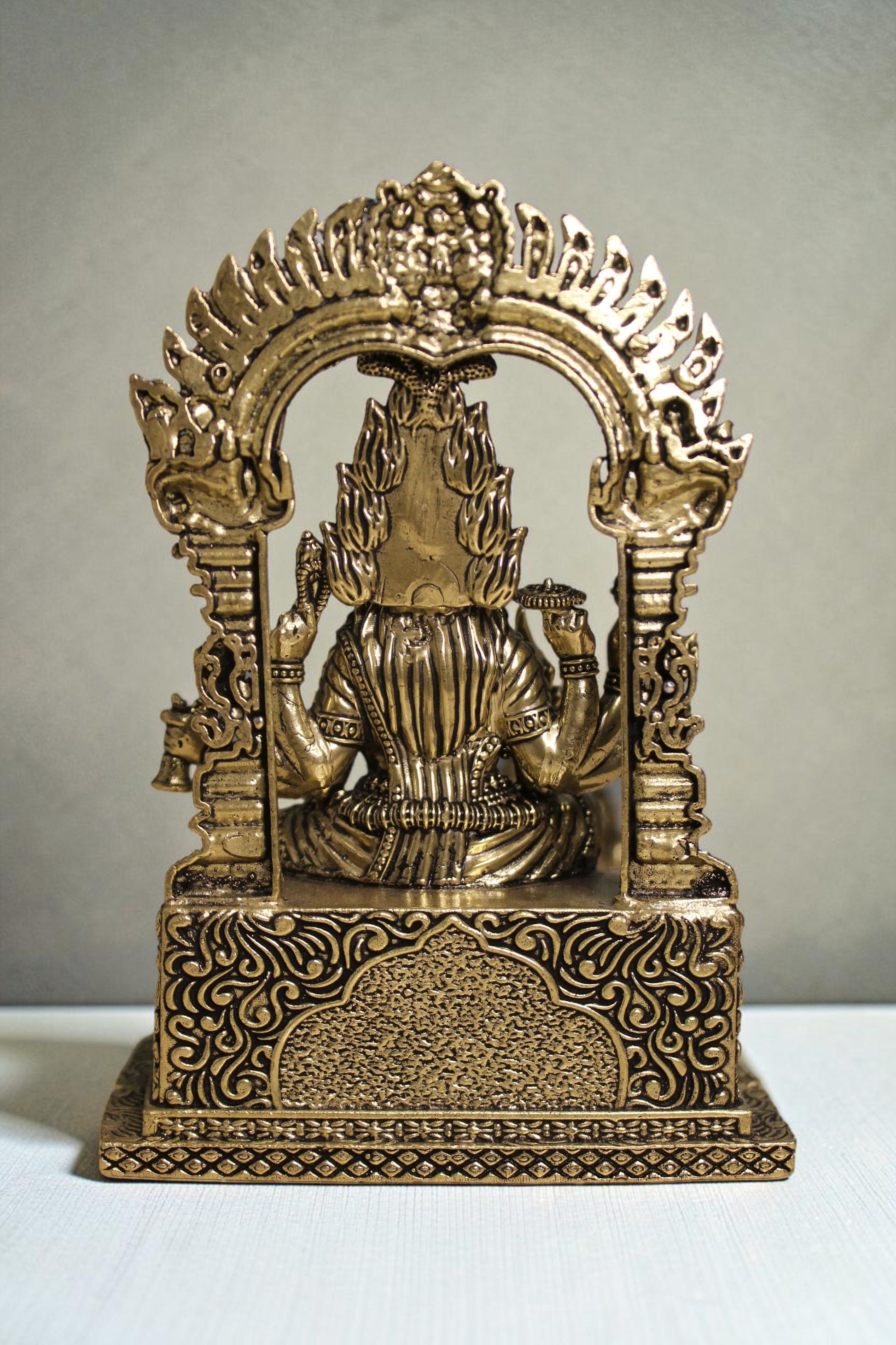 Rigvedaa™ brass idol of Goddess Mariamman in seated pose, adorned with ornaments, 6-inch, for home altars.