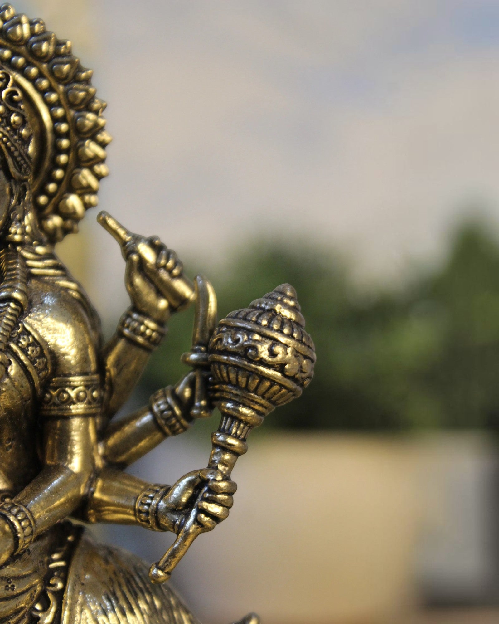 Rigvedaa™ Brass Meldi Maa statue on goat, folk goddess sculpture with intricate details and golden patina.