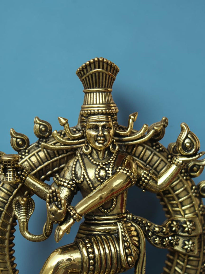 Close-up of a Rigvedaa™ brass Nataraja idol showing intricate details of Lord Shiva in his cosmic dance pose.