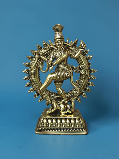 Rigvedaa™ golden brass Nataraja statue featuring Lord Shiva in a cosmic dance with intricate prabhamandala detailing.