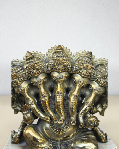 Rigvedaa™ Brass Panchmukhi Ganesha statue with five faces, intricate details, and golden patina. Handcrafted for spiritual wisdom and protection.