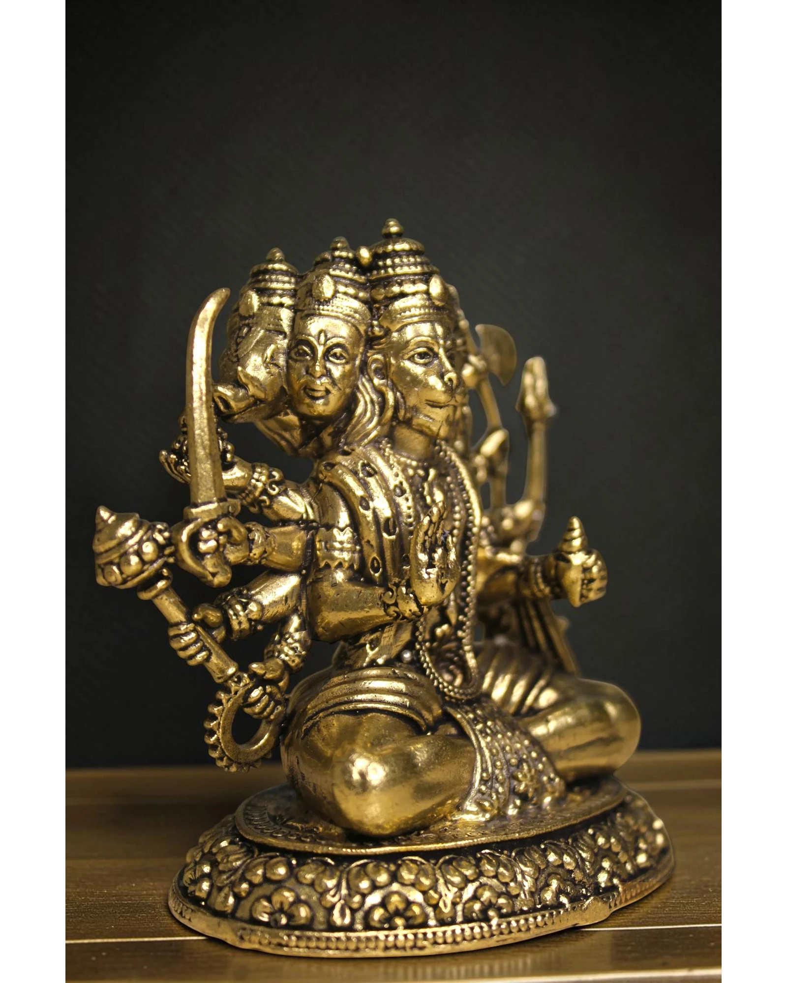 Rigvedaa™ brass Panchmukhi Balaji idol, a five-faced Hanuman statue in a sitting posture, holding various weapons. Intricate details and golden finish.