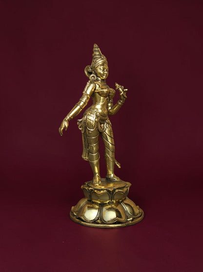 Rigvedaa™ brass Goddess Parvati idol standing on a detailed lotus base with intricate jewelry and golden finish.