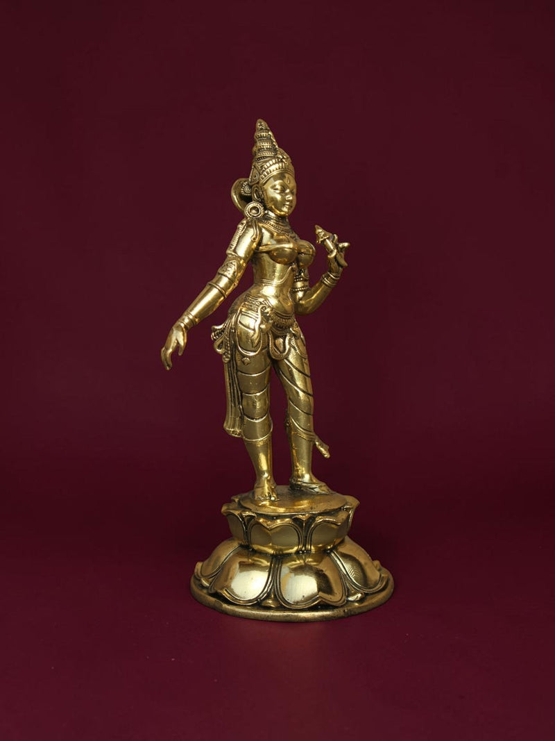 Rigvedaa™ brass Goddess Parvati idol standing on a detailed lotus base with intricate jewelry and golden finish.