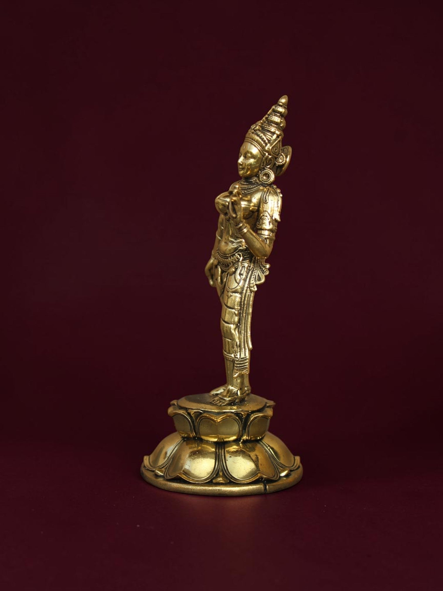 Rigvedaa™ brass Goddess Parvati idol standing on a detailed lotus base, featuring intricate relief work and gold finish.
