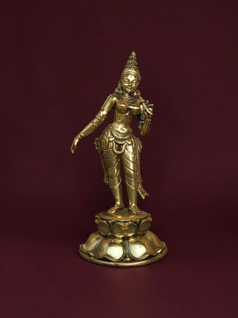 Rigvedaa™ brass Goddess Parvati idol standing on a detailed lotus base with intricate jewelry and golden finish.