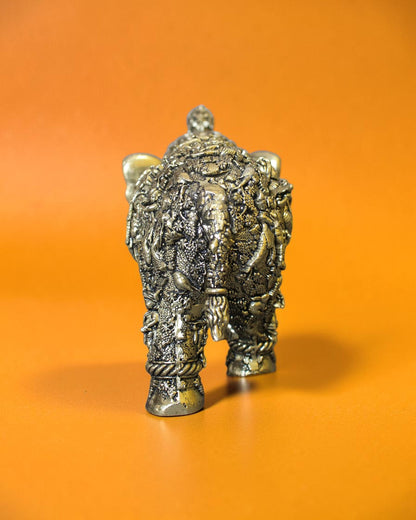 Rigvedaa™ brass elephant statue with intricate Radha Krishna murals, golden patina, and detailed engravings.