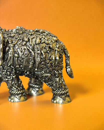 Rigvedaa™ brass elephant statue with Radha Krishna murals, intricate antique engravings, and detailed royal trappings.