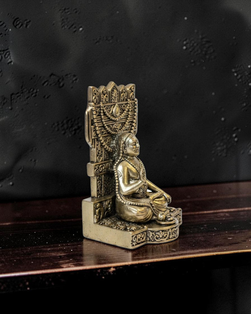 Rigvedaa™ brass idol of Raghavendra Swamy in traditional seated posture with serene expression, intricate detailing, and ornate throne.