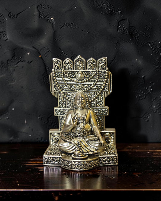 Rigvedaa™ brass idol of Raghavendra Swamy in seated posture, intricate detailing, traditional attire, for home temple and puja.