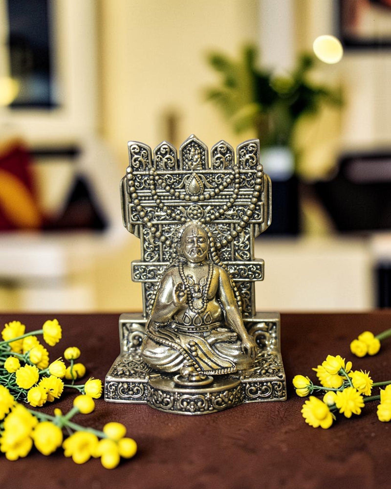 Rigvedaa™ brass idol of Raghavendra Swamy in seated posture, intricate detailing, traditional attire, for home temple and puja.