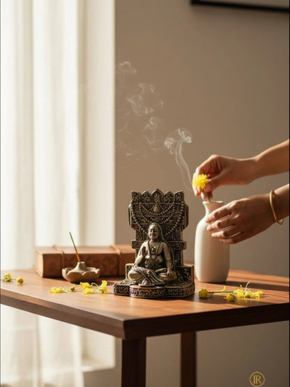 Rigvedaa™ brass Raghavendra Swamy idol in a serene home temple setting with incense smoke and yellow flowers