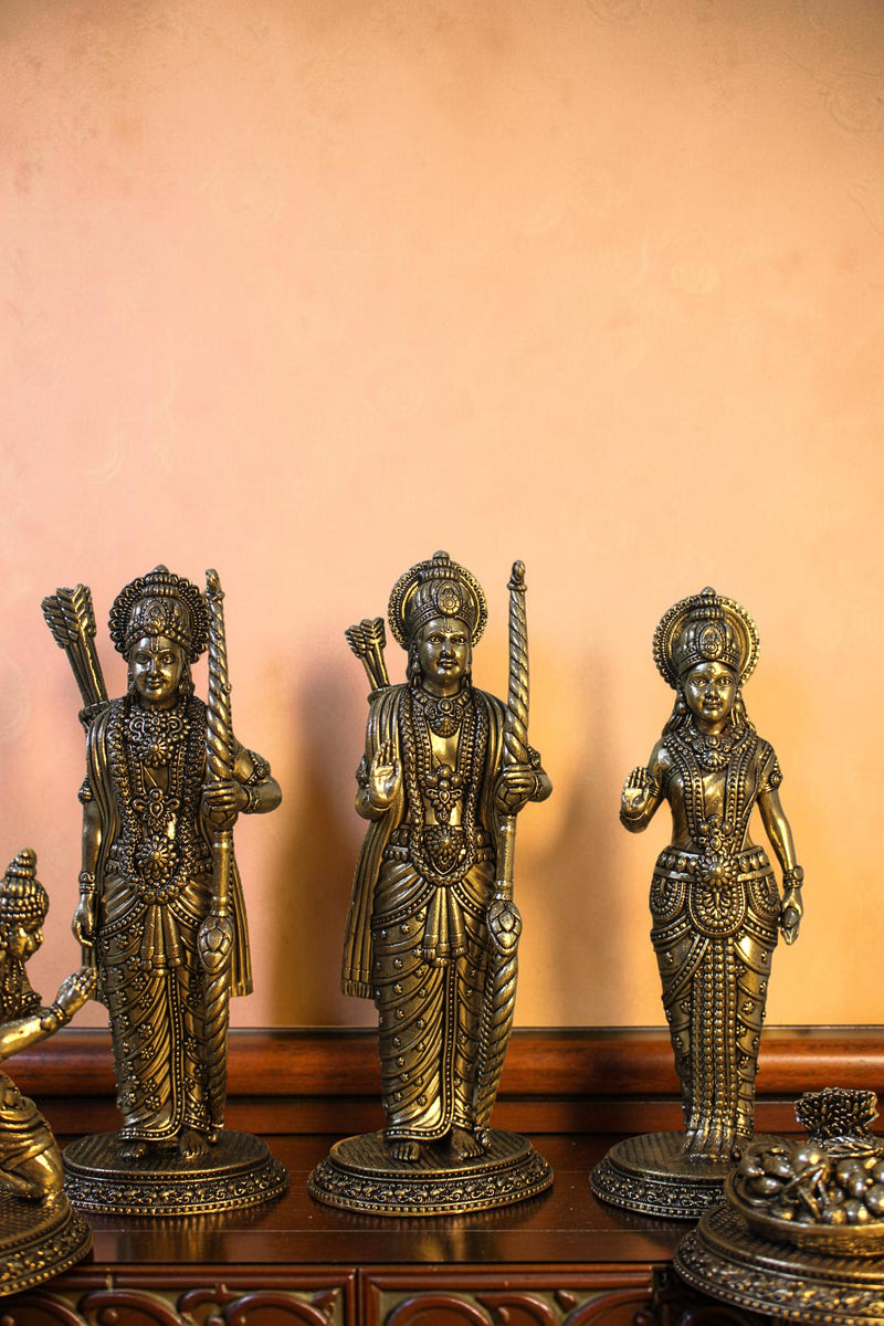Rigvedaa™ antique brass Ram Darbar idol set featuring Lord Ram, Sita, Lakshman, and Hanuman in detailed poses with bows and offerings.