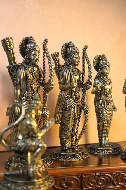 Rigvedaa™ antique brass Ram Darbar idol set featuring Ram, Sita, Lakshman, and Hanuman. Intricately detailed figures with bows and arrows.
