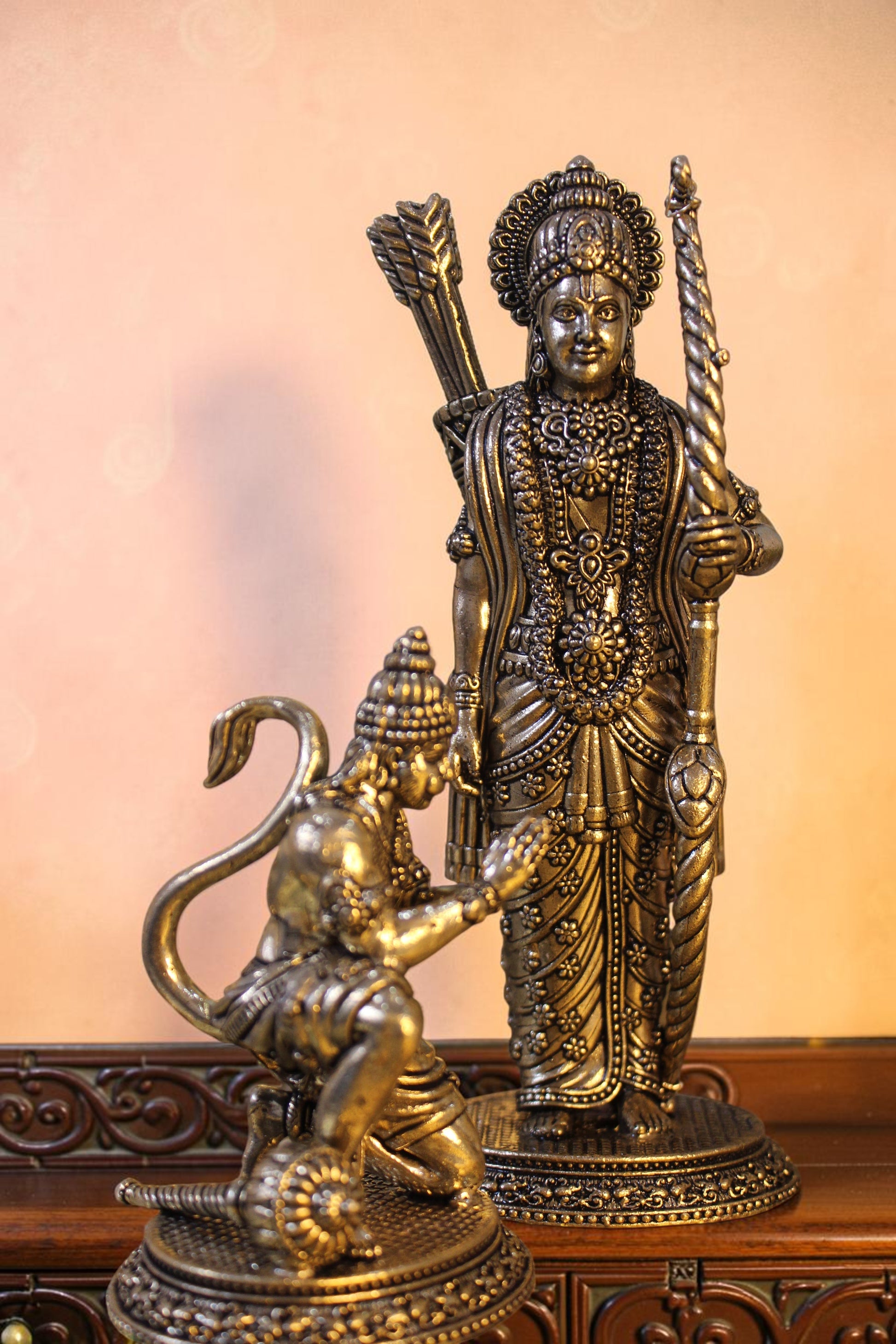Rigvedaa™ antique brass Ram Darbar idol set with Ram, Sita, Lakshman, and Hanuman. Ram holds a bow, Hanuman kneels.