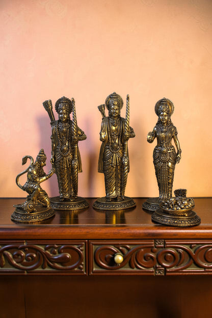 Rigvedaa™ antique brass Ram Darbar idol set featuring Ram, Sita, Lakshman, and Hanuman. Intricately detailed figures with bows and graceful poses.