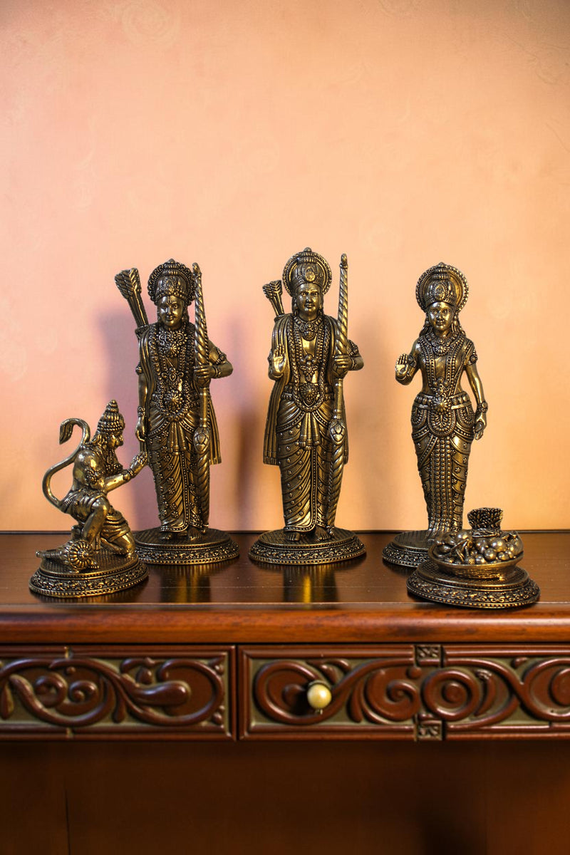 Rigvedaa™ antique brass Ram Darbar idol set featuring Ram, Sita, Lakshman, and Hanuman. Intricately detailed figures with bows and graceful poses.