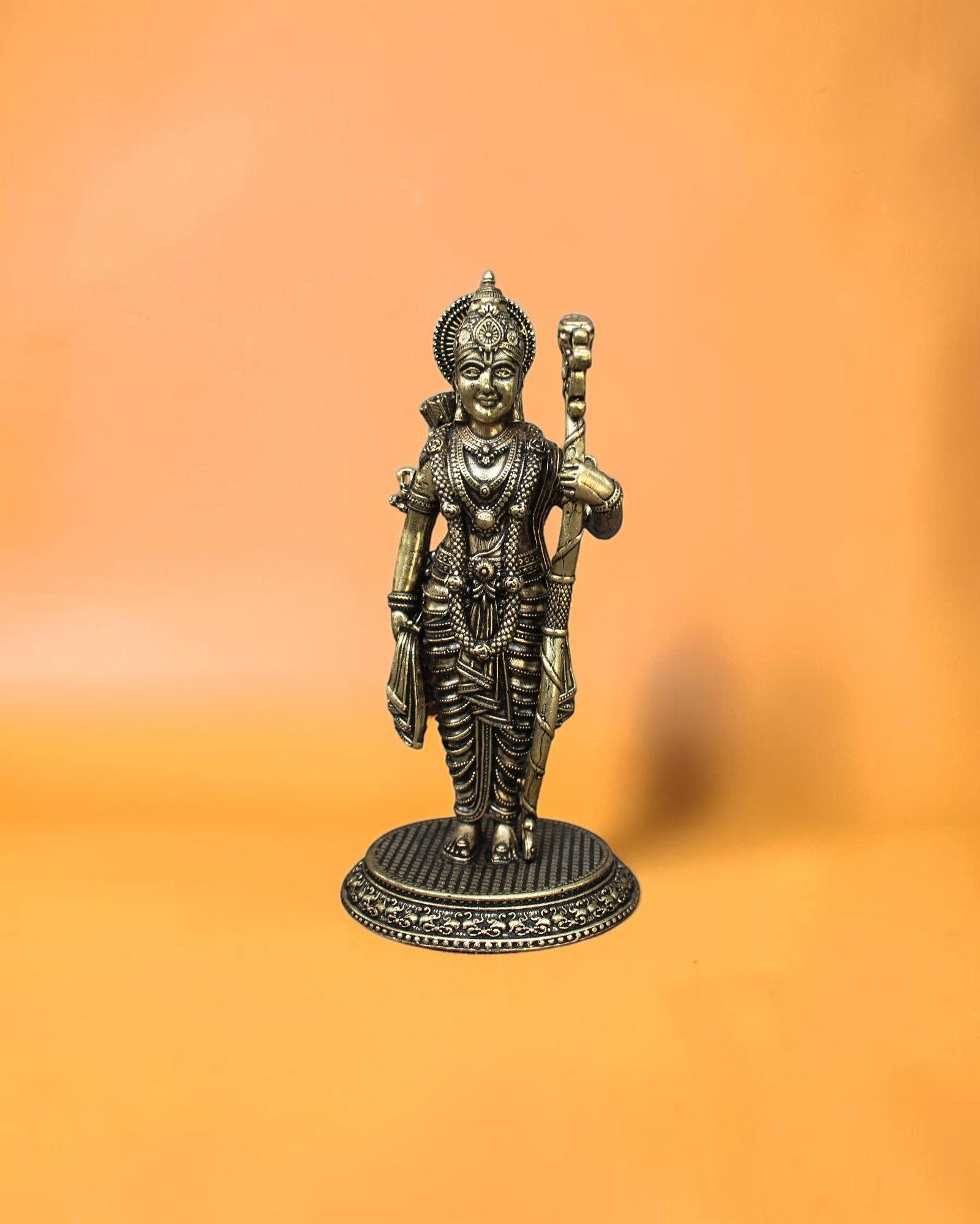 Rigvedaa™ Brass Ram Darbar statue set featuring Lord Rama, Sita, Lakshmana, and Hanuman in intricate detail, holding a bow and arrow.