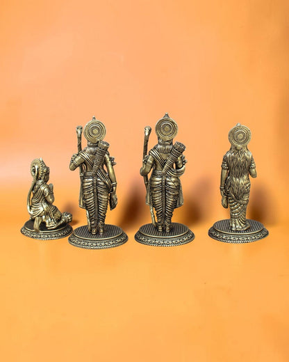 Rigvedaa™ Brass Ram Darbar statue set featuring Rama, Sita, Lakshmana, and Hanuman in traditional attire with intricate detailing. Rama holds a bow, Sita radiates grace, Lakshmana stands beside them, and Hanuman kneels in devotion.