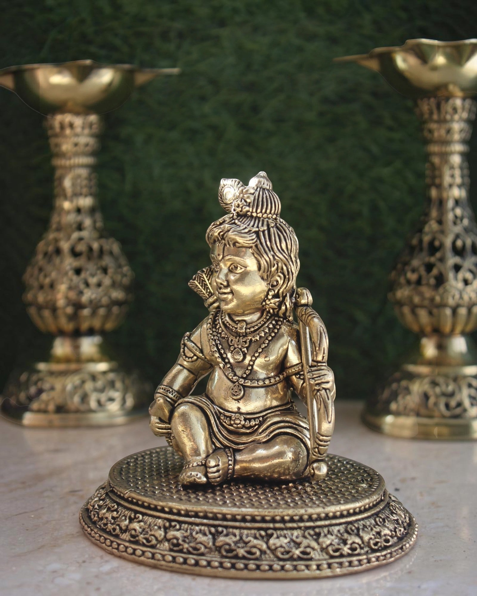Rigvedaa™ brass Ram Lalla idol featuring intricate Bal Ram details on a circular base for home temple worship